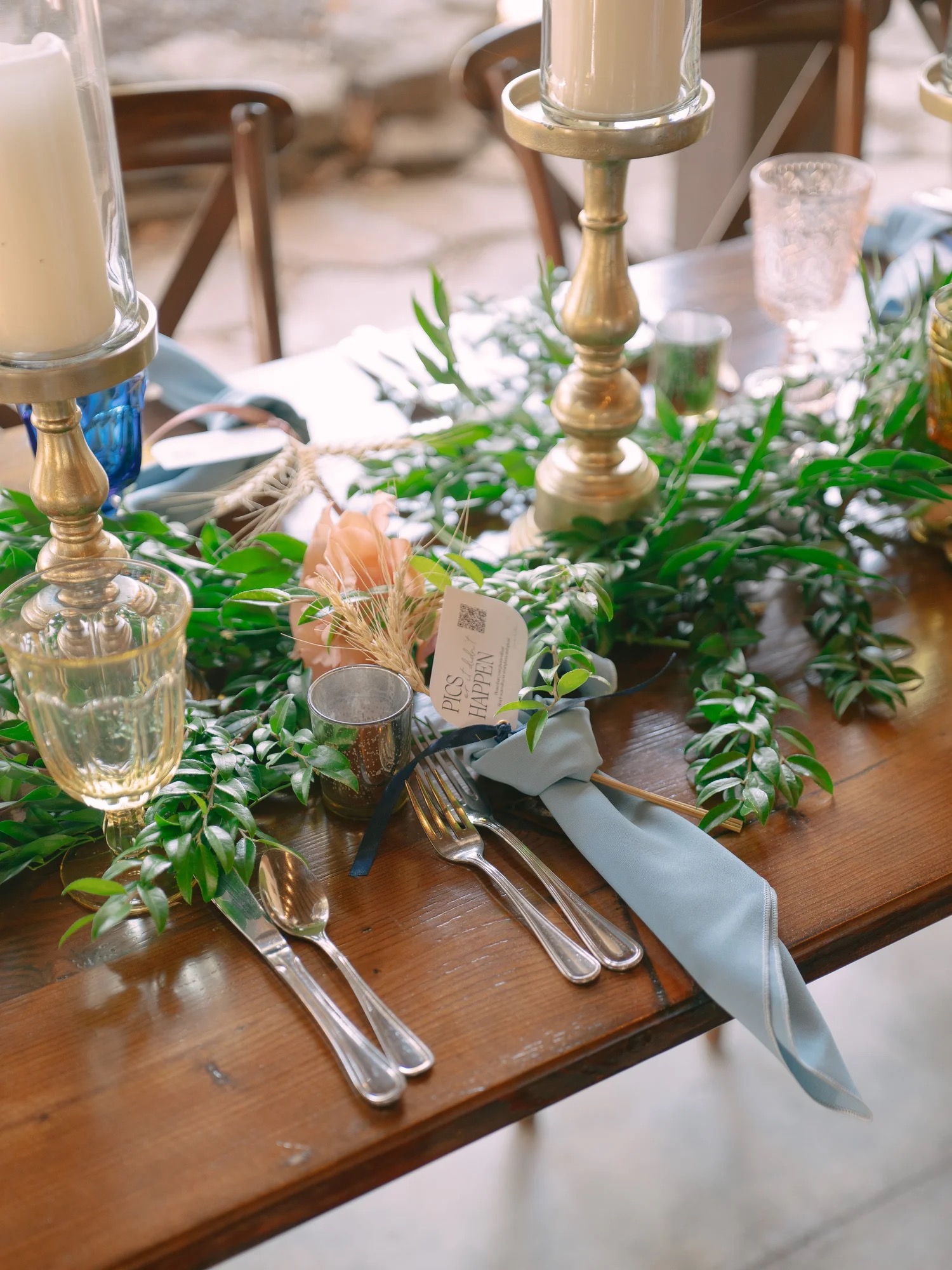 Candlelit floral reception table at The Barn at Riverbend