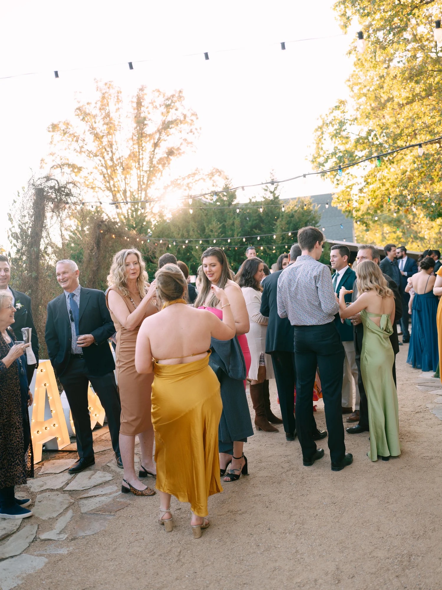 Lauren and Adam posing with their dog after their Barn at Riverbend wedding