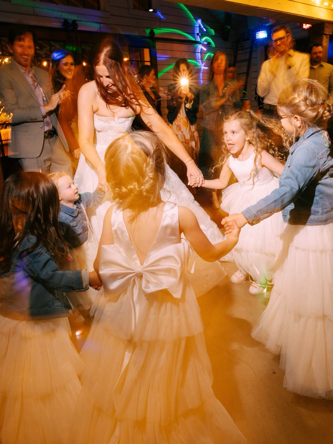 Lauren dancing with flower girls at her Barn at Riverbend reception