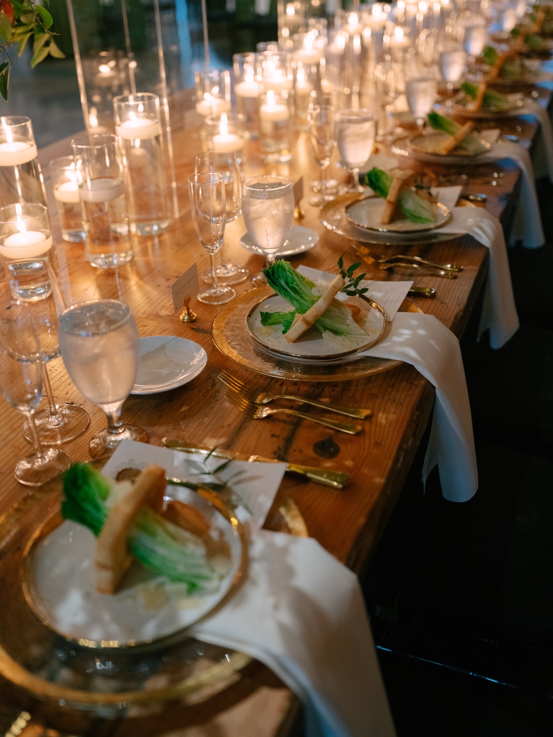 Candlelit place settings at Lauren and Logan's The Guild reception