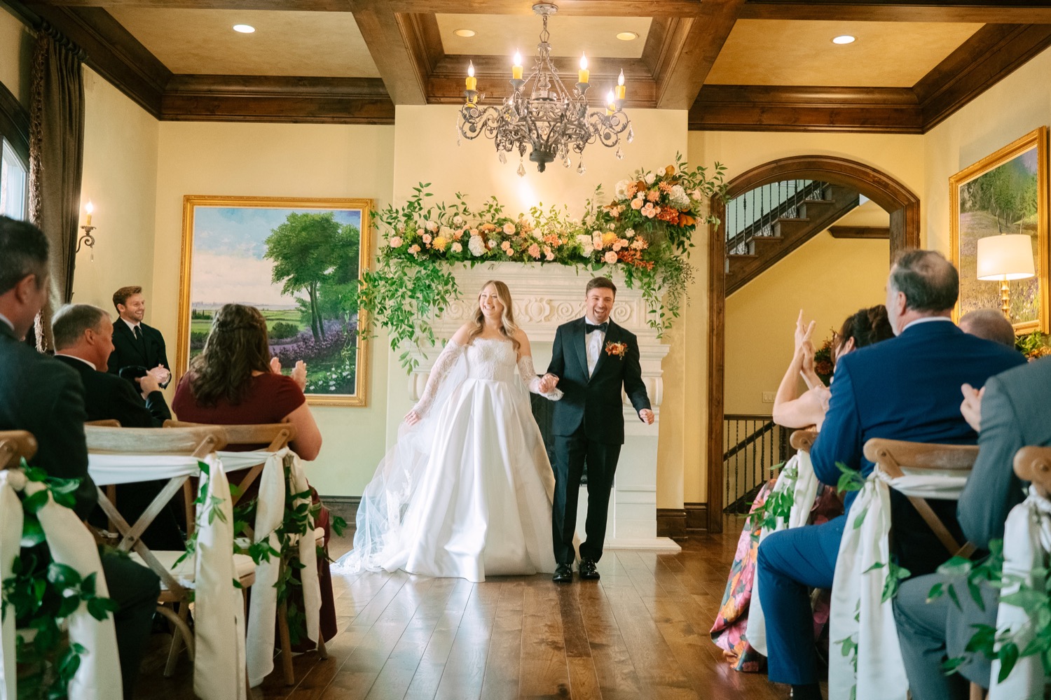Lauren and Logan walking down the aisle after their home wedding ceremony